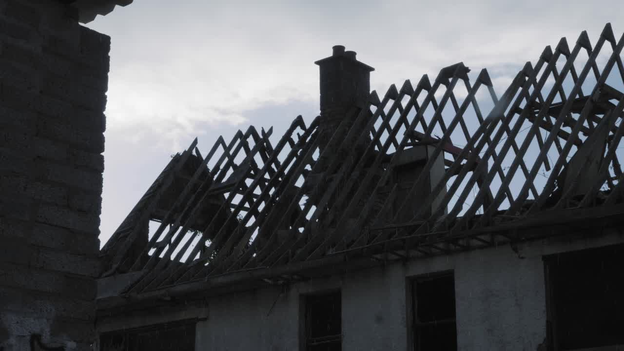 Rain Falling On The Damaged House And Old Wall In Northern Ireland - Medium Shot