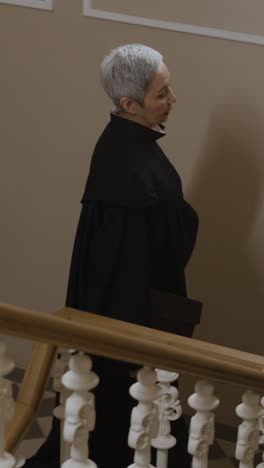 judge walking upstairs