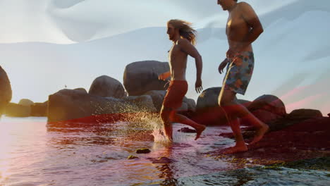 walking through shallow water, two people near large rocks at beach animation