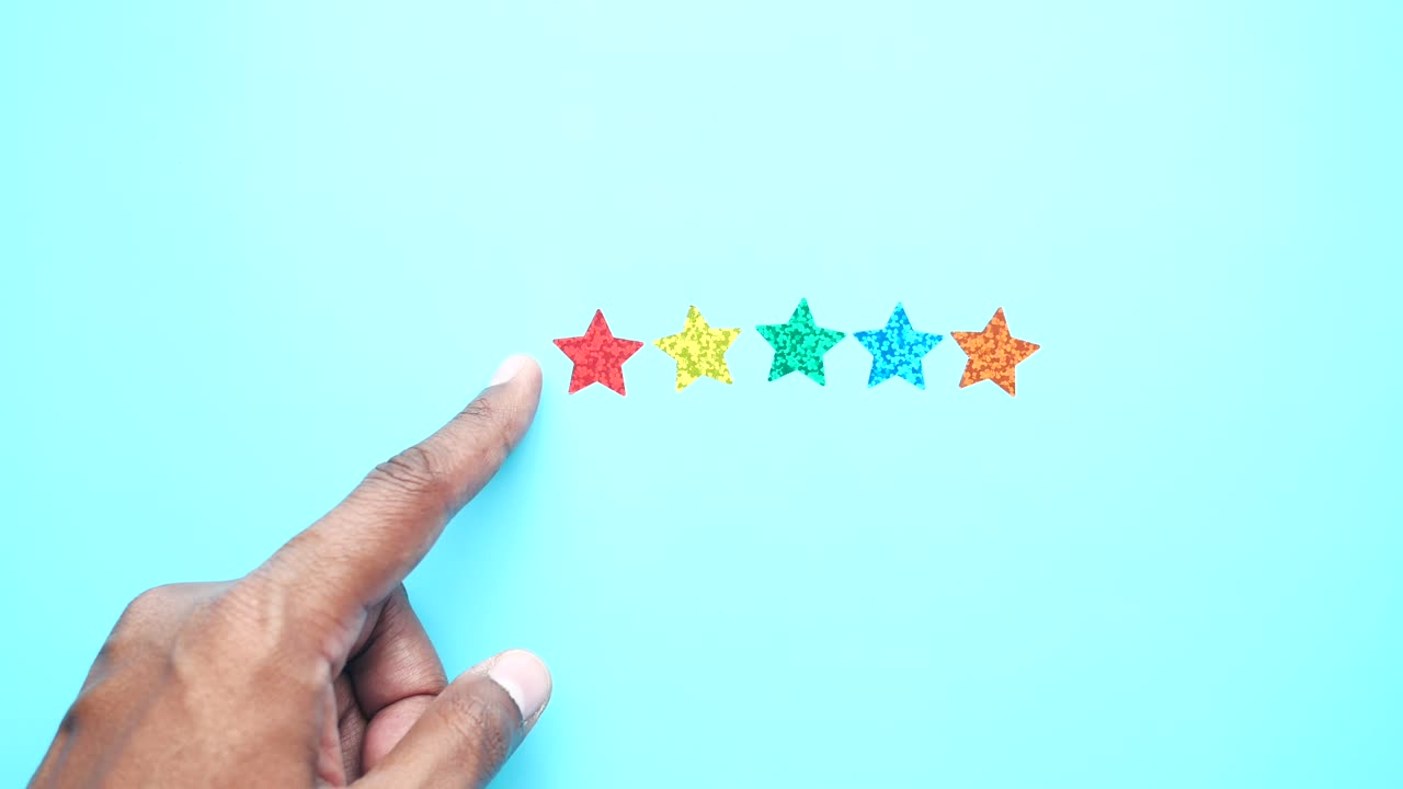 Hand Pointing to Five Star Rating