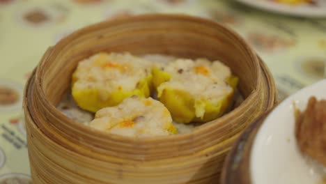 sachets of siomay indonesian food in a wooden box ready to eat