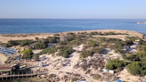 aerial shot of the sea coast and a beach at a holiday resort