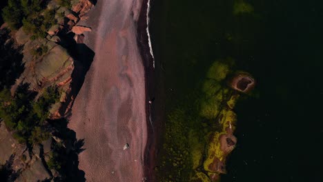 birds eye drone shot over the iron beach, sunny, summer day in jussaro, finland