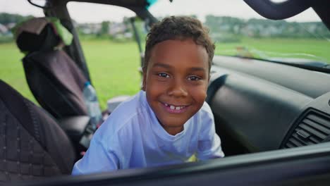 happy boy inside a car