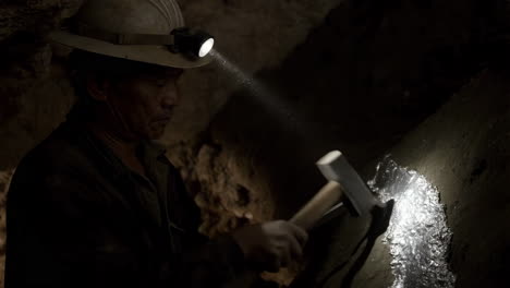 miner working in a cave