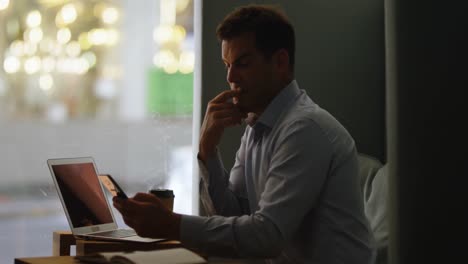 executive using mobile phone in office cafeteria 4k