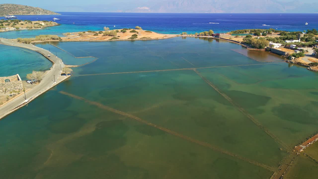Low drone view of sunken archaeological site of Olous, Elounda, Crete, Greece.