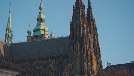 gothic spires of st. vitus cathedral with intricate details highlighted by the evening light. parallax video.