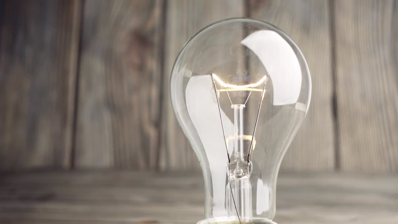 Light bulb on wood background