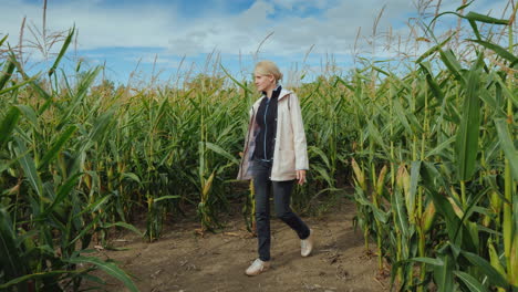 young woman's outdoor activity inside a large corn maze