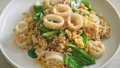 fried rice with squid or octopus - stir-fried rice with squid, egg and kale