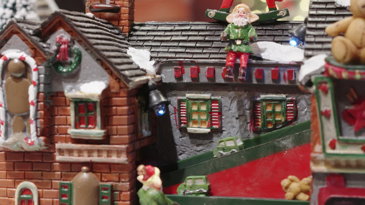 Festive Christmas Village Display with Moving Figures and Gifts