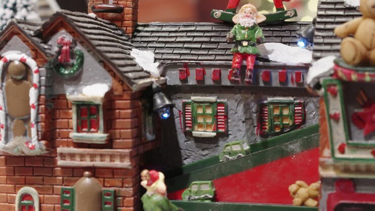 Festive Christmas Village Display with Moving Figures and Gifts