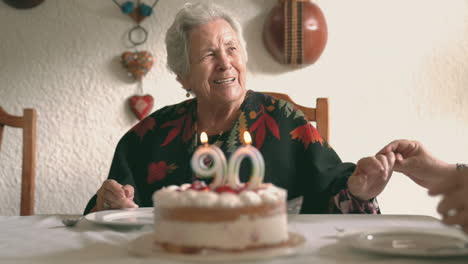 senior woman with female guest celebrating birthday