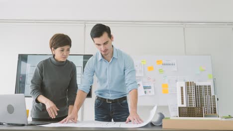 team of creative architects working together in a architect studio