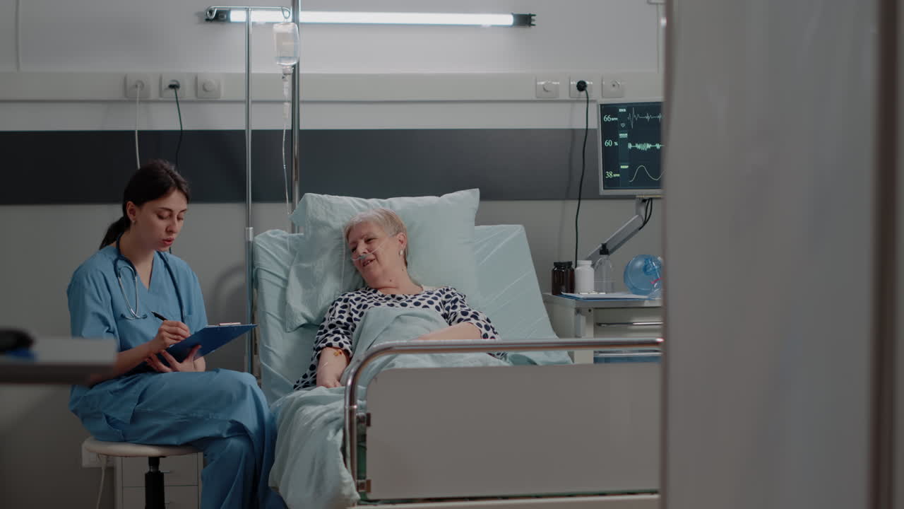 Medical assistant doing checkup visit with ill patient for healthcare
