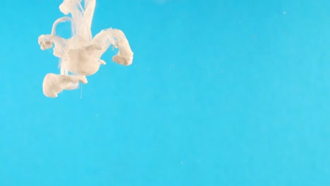 ink in water. white paint on blue reacting in water creating abstract cloud formations.can be used as transitions,added to modern grunge projects,art backgrounds, anything with creative twist