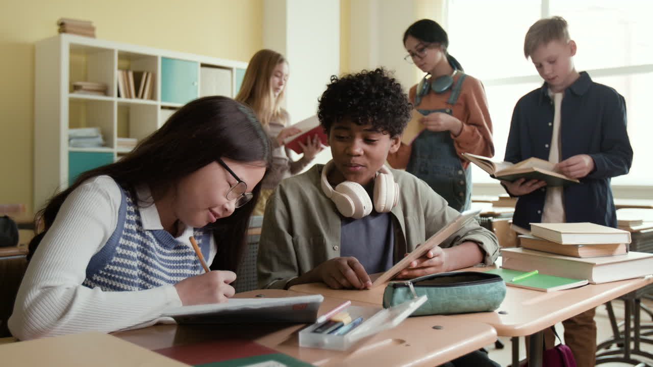 Diverse group of students studying and collaborating in a classroom.