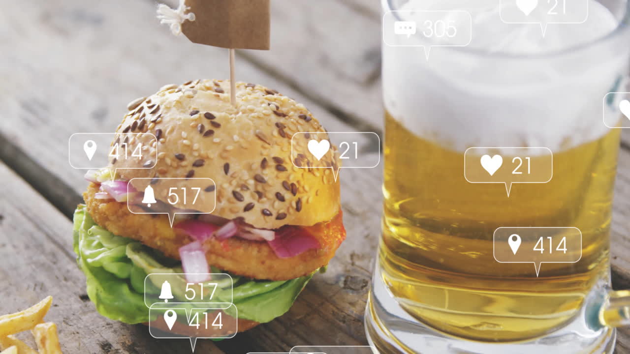 Burger and beer on table with animation of social media notification icons