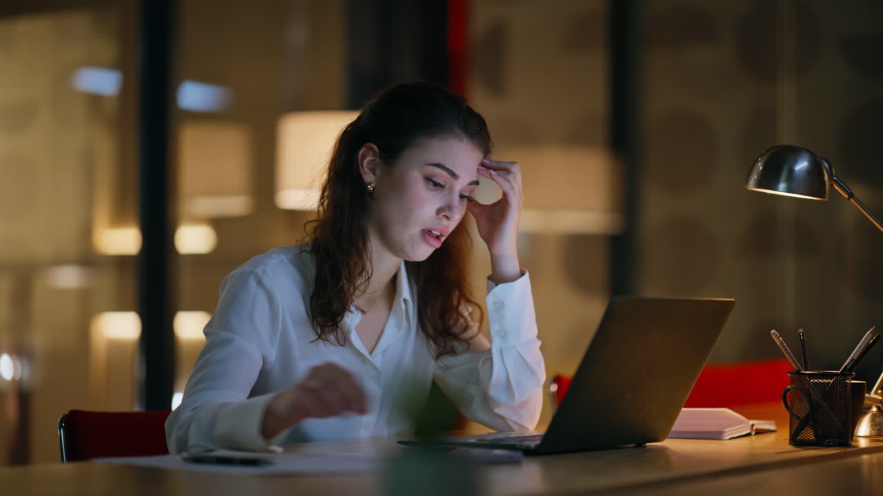 Manager unmotivated overtime work sitting at laptop closeup. Sad businesswoman