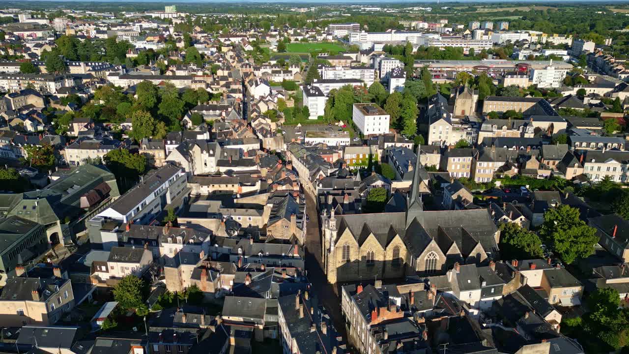 Saint-Vénérand church aka Église Saint-Vénérand with a central apse surrounded Laval cityscape from above, Mayenne, France