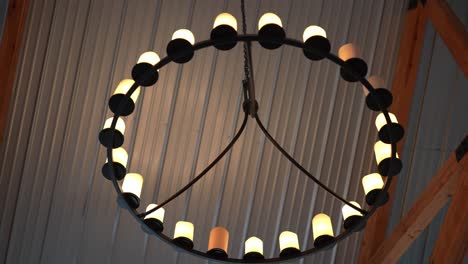 a-stunning-wheel-shaped-pendant-light,-illuminating-its-surroundings-with-a-captivating-play-of-light-and-shadows