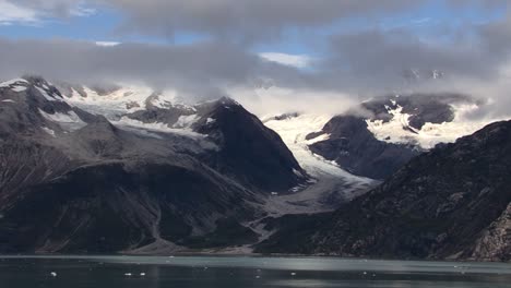 beautiful landscape from glacier bay national park in alaska, with cloud covered mountains and glaciers