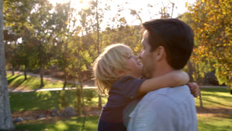 Slow-Motion-Sequence-Of-Father-Hugging-Son-In-Park