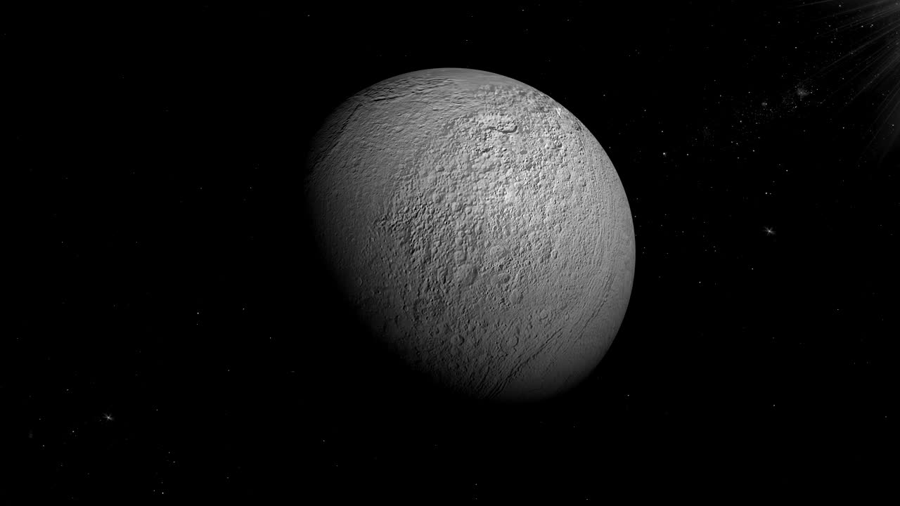 tethys, la luna de saturno, girando en su propia órbita en el espacio exterior.