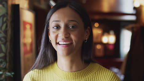 Head-And-Shoulders-Portrait-Of-Attractive-Smiling-Woman-Inside-Hotel