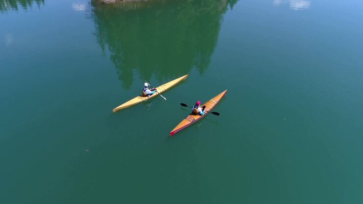 People kayaking in lake 4k
