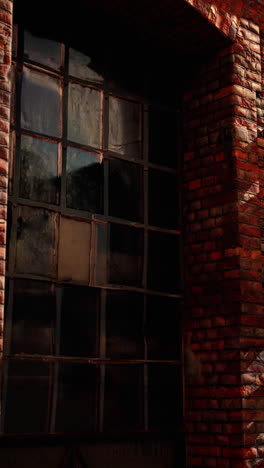 old brick building with a large window