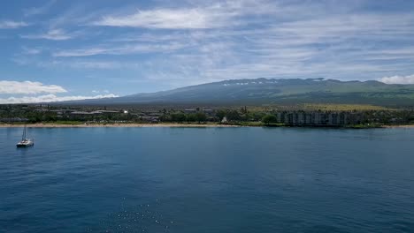 aerial view of sailboat and kamaole beach on maui hawaii on sunny day.