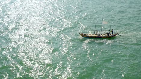 aerial shot of a boat in a sea during the day