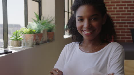 portrait confident african american woman smiling enjoying successful lifestyle happy female student relaxing at home in trendy apartment