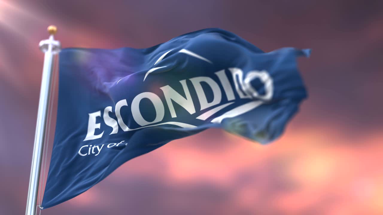 bandera de escondido al atardecer, ciudad de california, estados unidos de américa - bucle