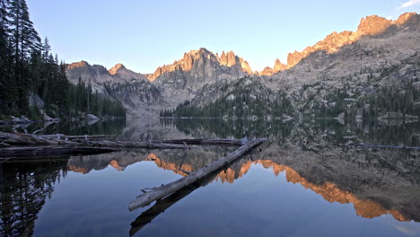 beautiful sunrise over glassy baron lake in sawtooth mountains idaho