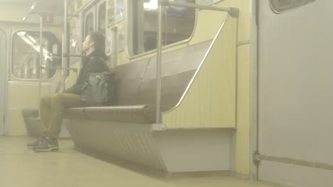 man sitting on a subway