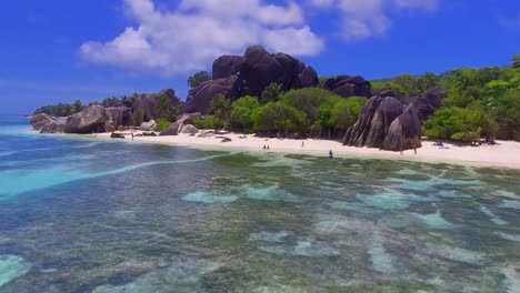 the seychelles, vibrant view of la digue beach with cristal clear waters