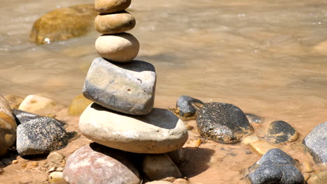 cairn along a riverbank in zion national park, utah