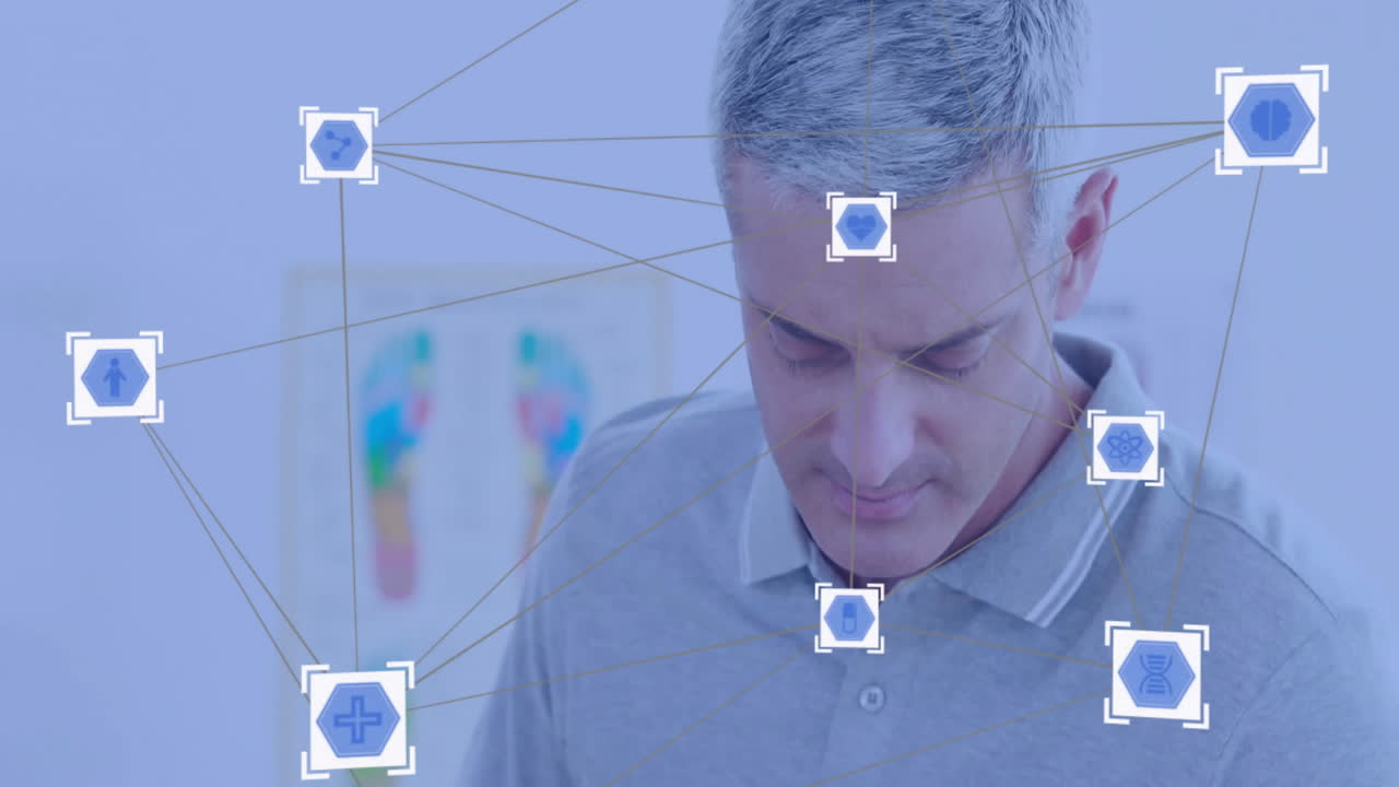 Medical icons and network connections animation over man in gray shirt
