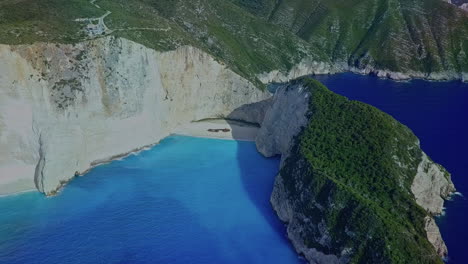 wide aerial orbiting navagio shipwreck beach on zakynthos greece island