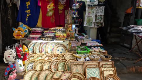 various handicrafts displayed at a vibrant market stall