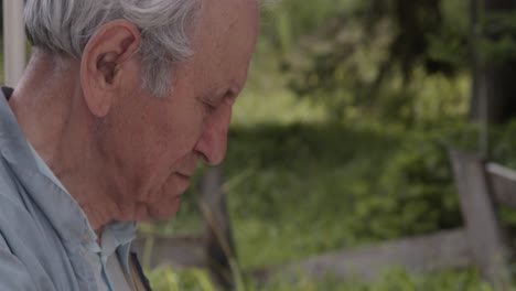 old man working in garden, profile