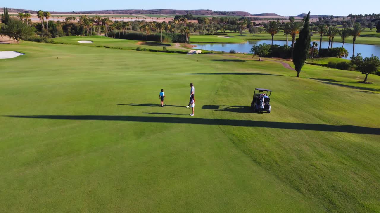 Family Golfing on a Beautiful Golf Course