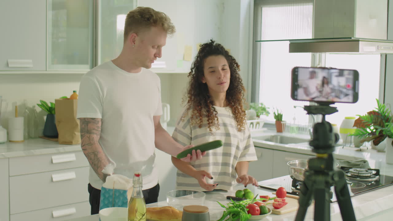 Gen Z Couple Filming Culinary Masterclass with Phone in Kitchen