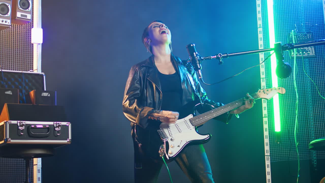 Woman playing electric guitar on stage