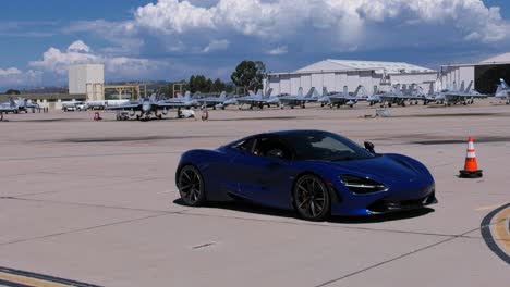 luxury cars drive through airport