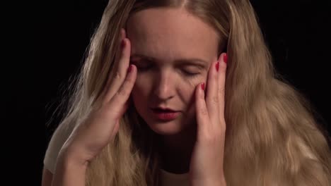 a european blond girl having a migraine