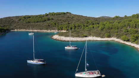 tourists on boats enjoying beautiful sea and islands at hvar, croatia in summer